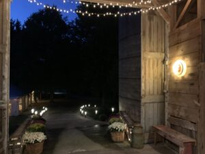 Inside the Barn 1893 with dressed tables at the event venue, Hampshire Illinois